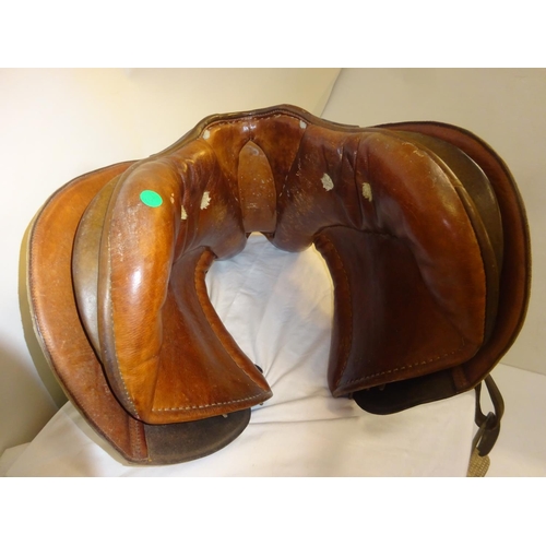 54 - Leather saddle and a harness mirror.