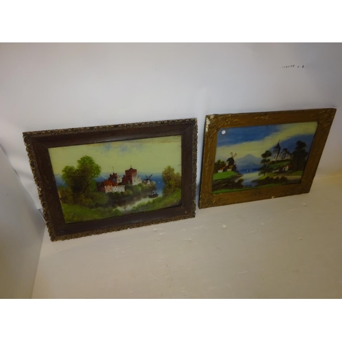 57 - A pair of framed Victorian pictures on glass, landscapes with castles. 40cm x 60cm.