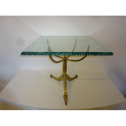 58 - An unusual brass based occasional table with heavy square glass top. 60cm x 60cm.