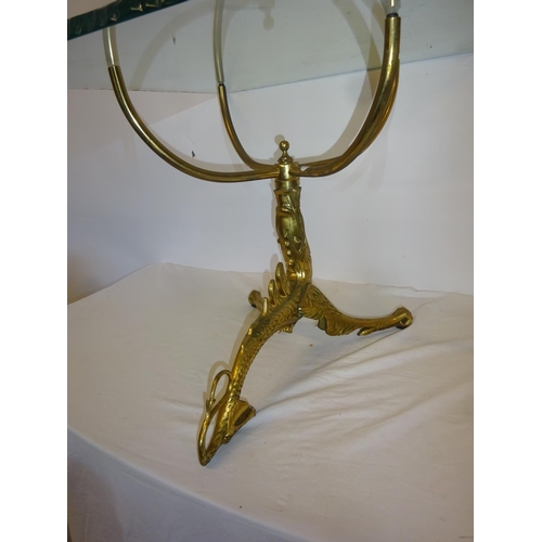 58 - An unusual brass based occasional table with heavy square glass top. 60cm x 60cm.