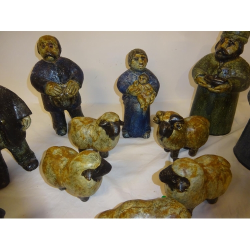 59 - A collection of pottery crib figures.