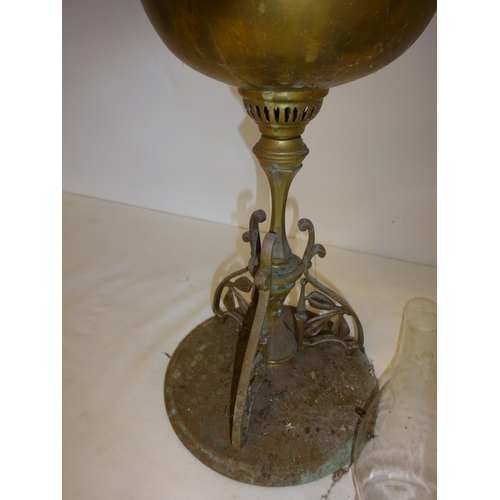 60 - Two Victorian oil lamps with oil glass shades (chip on rim of green shade and green bowl cracked).