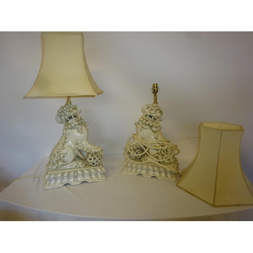 64 - A pair of China Foo dog lamps and shades. H. of lamp 50cm approx.