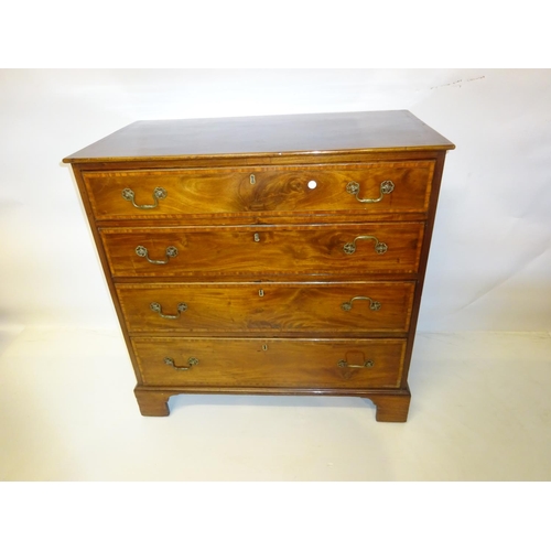 70 - A fine antique mahogany chest of 4 graduated drawers having brass handles and raised on bracket feet... 