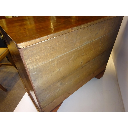 70 - A fine antique mahogany chest of 4 graduated drawers having brass handles and raised on bracket feet... 