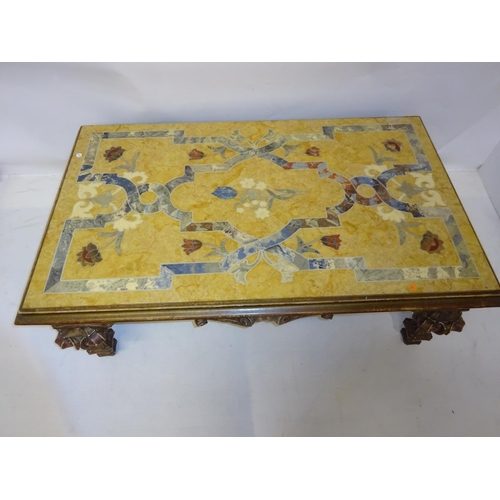73 - A good continental lounge table having a fine inlaid rectangular shaped marble top on carved decorat... 