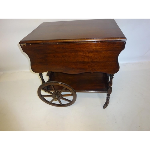 8 - A mahogany drop leaf hostess trolley on wheels. W. 65cm.