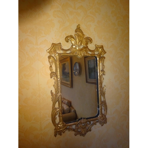 80 - Decorative carved wood and gilded mirror. 80cm x 40cm approx.