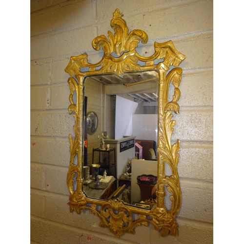 80 - Decorative carved wood and gilded mirror. 80cm x 40cm approx.