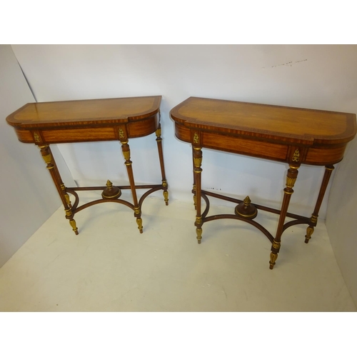 82 - A fine pair of decorative satinwood side tables, the shaped D ended tops having rosewood cross bandi... 