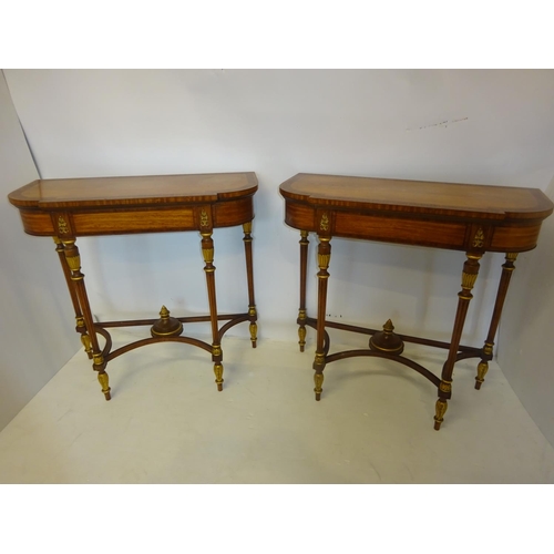 82 - A fine pair of decorative satinwood side tables, the shaped D ended tops having rosewood cross bandi... 