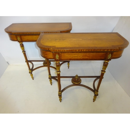 82 - A fine pair of decorative satinwood side tables, the shaped D ended tops having rosewood cross bandi... 