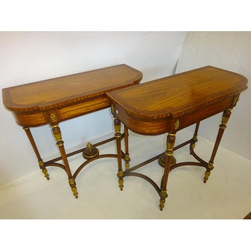 82 - A fine pair of decorative satinwood side tables, the shaped D ended tops having rosewood cross bandi... 