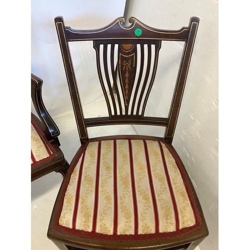 92 - Edwardian inlaid mahogany two seater settee having nicely shaped back, open arms and raised on cabri... 