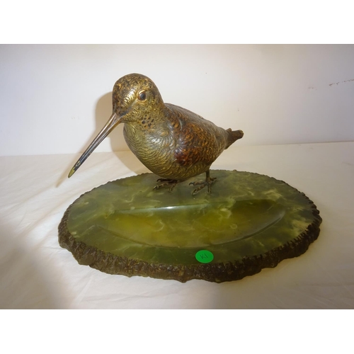 97 - A 20th century Austrian cold painted cast bronze figure of a bird sitting on an oval onyx base. W. 3... 