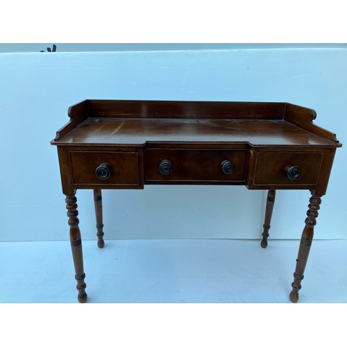 368 - A 19th century mahogany (Cork) side table having a tray back and fitted with three drawers. W. 118cm... 