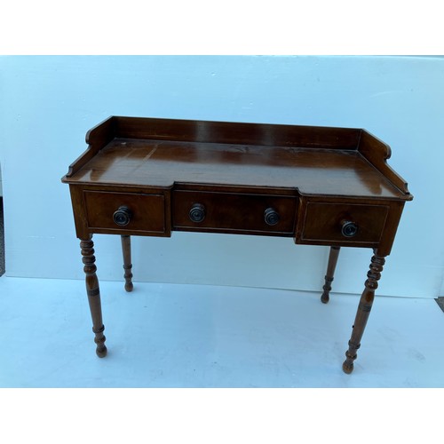 368 - A 19th century mahogany (Cork) side table having a tray back and fitted with three drawers. W. 118cm... 