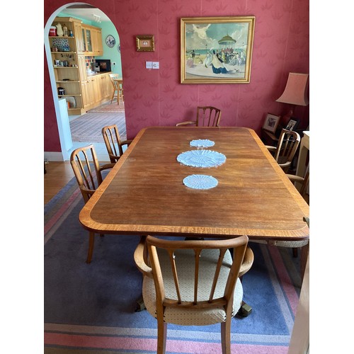119 - A fine well made Georgian style dining table, the mahogany tops having satinwood cross banding and r... 