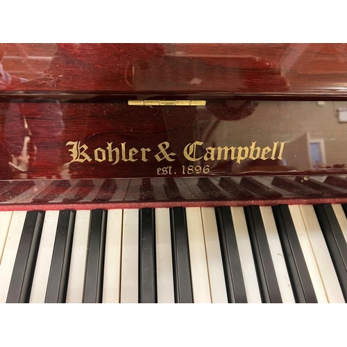 100 - Kohler & Campbell - A very good upright overstrung piano. W. 146cm, H. 109cm, D. 56cm approx.