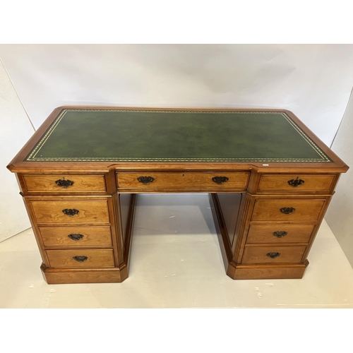 104 - An excellent quality cherry wood pedestal desk, the shaped top having tooled leather inset and the e... 