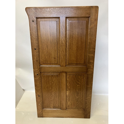 105 - A good antique oak filing cabinet fitted with 4 drawers and having panelled sides and back. H. 135cm... 