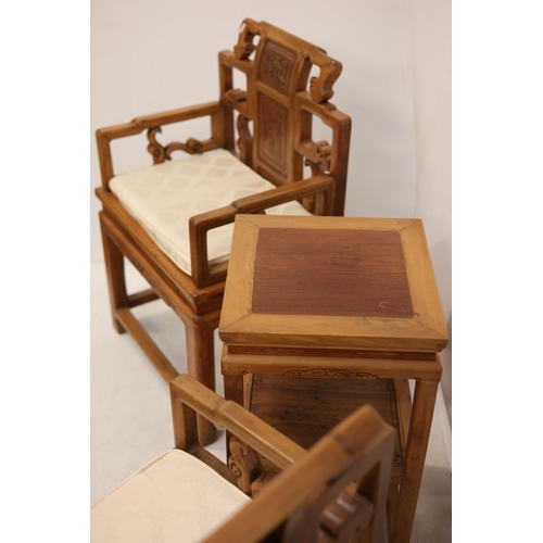 108 - A pair of Chinese style fruit wood armchairs and lamp table. (3)