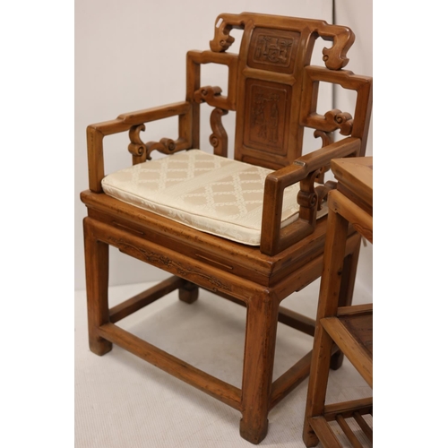 108 - A pair of Chinese style fruit wood armchairs and lamp table. (3)