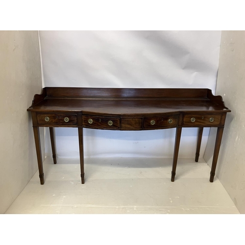 115 - A good Georgian mahogany side table, the shaped tray back top fitted with 4 drawers and raised on ta... 