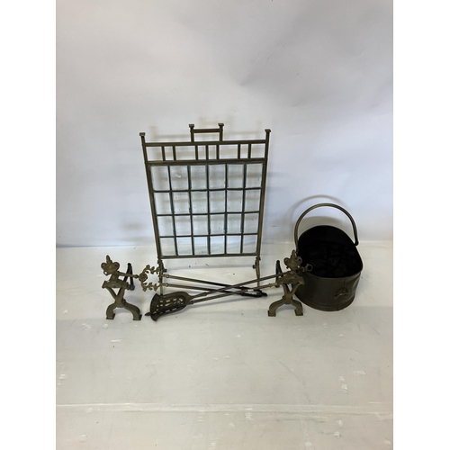 117 - Victorian brass and leaded brass firescreen, brass coal helmet, brass fire irons and fire rests.