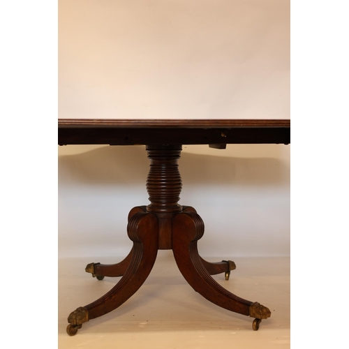 119 - A good Cork Regency mahogany breakfast table, the reeded top raised on turned centre column with fou... 