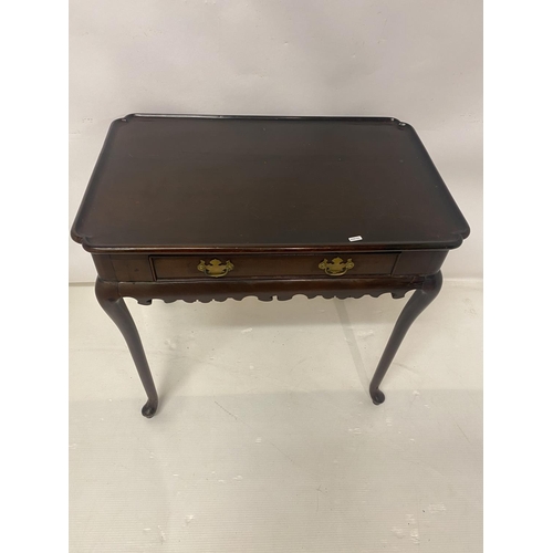 124 - Antique mahogany silver table having shaped top over single drawer and raised on cabriole legs. W. 7... 