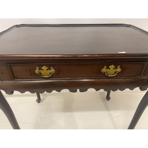 124 - Antique mahogany silver table having shaped top over single drawer and raised on cabriole legs. W. 7... 