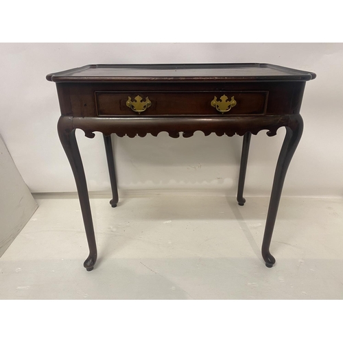 124 - Antique mahogany silver table having shaped top over single drawer and raised on cabriole legs. W. 7... 