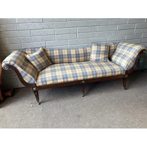 129 - A large Regency mahogany couch having reeded decoration with brass mounts and nicely upholstered. (s... 