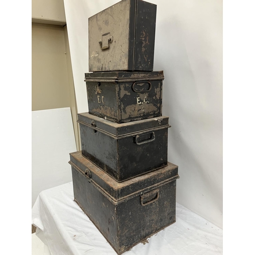 13 - Four old metal storage boxes, various sizes.