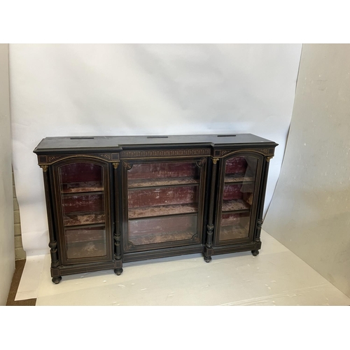 134 - A good 19th century inlaid and ebonized side cabinet having a large centre door and two arched top s... 