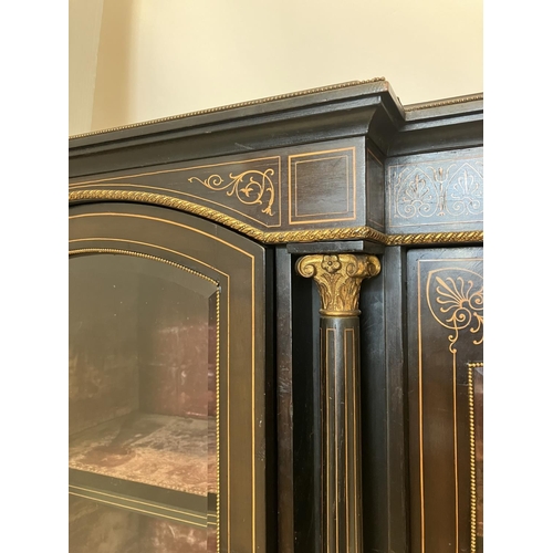 134 - A good 19th century inlaid and ebonized side cabinet having a large centre door and two arched top s... 