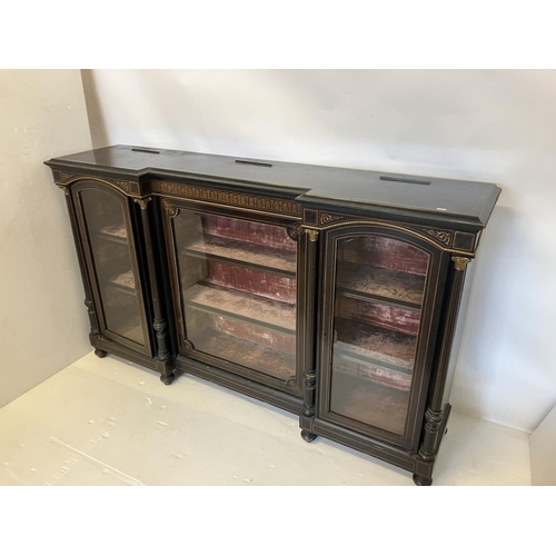 134 - A good 19th century inlaid and ebonized side cabinet having a large centre door and two arched top s... 