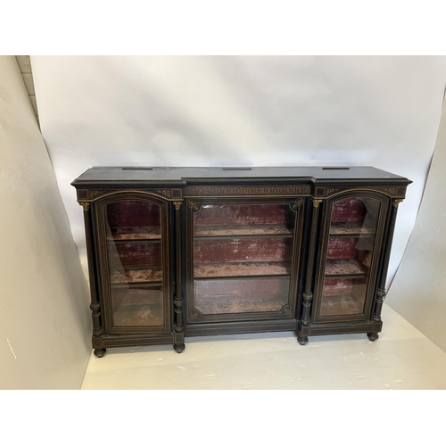 134 - A good 19th century inlaid and ebonized side cabinet having a large centre door and two arched top s... 