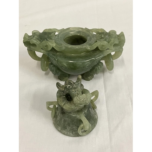 139 - A jade ornament and a soap stone figure (damaged).