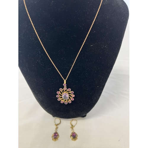 186 - 9ct gold amethyst pendant and matching earrings.