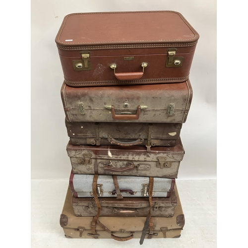 19 - A quantity of old suitcases. (7)