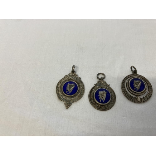 199 - Three Irish silver medals or pendants. Dublin 1946. Maker J.M. Company.