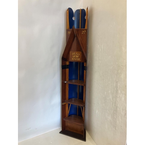 20 - Free standing shelf unit in the form of a rowing boat. H. 220cm, W. 44cm approx.