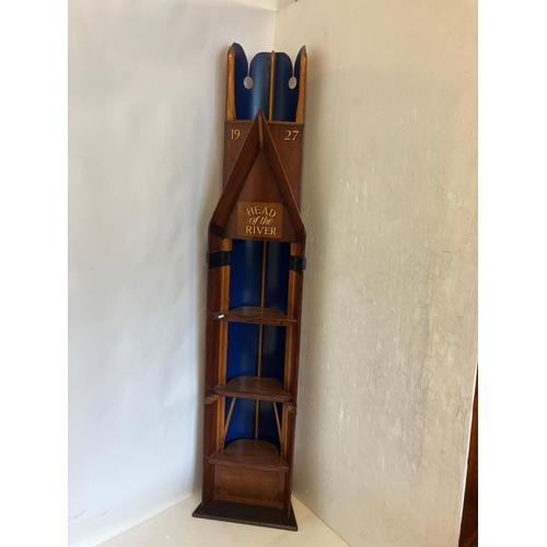 20 - Free standing shelf unit in the form of a rowing boat. H. 220cm, W. 44cm approx.