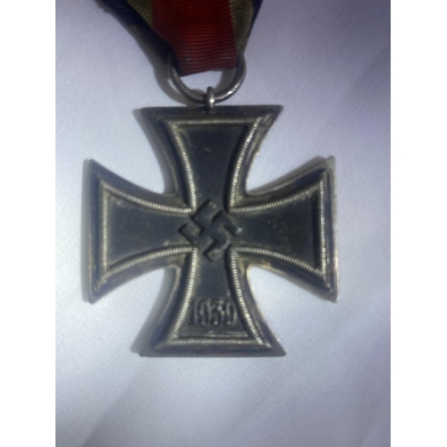 205 - German Iron Cross breast badge, silver with iron core and makers details to suspension ring.