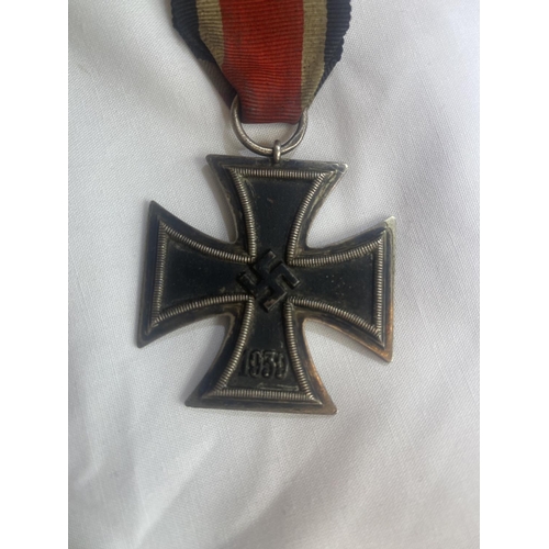 205 - German Iron Cross breast badge, silver with iron core and makers details to suspension ring.