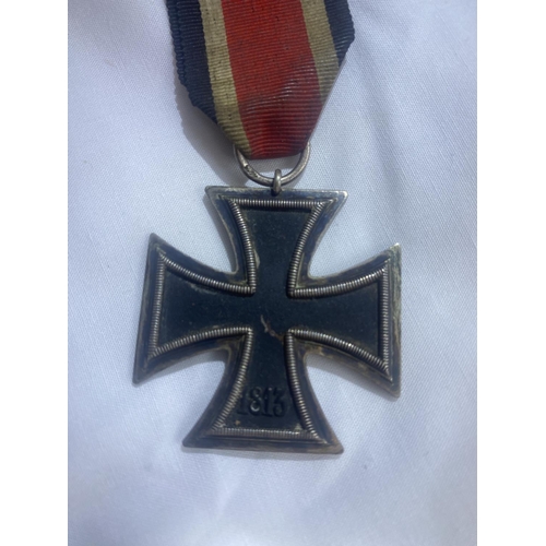 205 - German Iron Cross breast badge, silver with iron core and makers details to suspension ring.