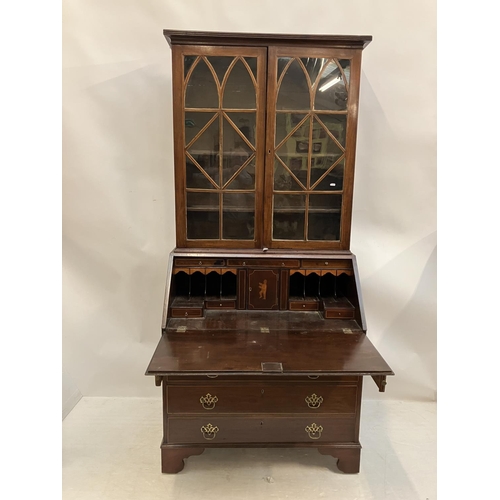 226 - Georgian mahogany bureau bookcase having a well fitted interior, 2 short and 3 long drawers and rais... 