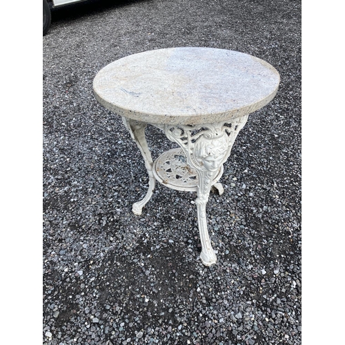 233 - Marble top garden table on cast iron base.